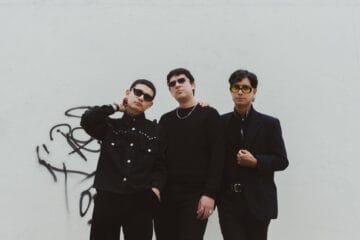 Los Estroboscópicos con trajes negros