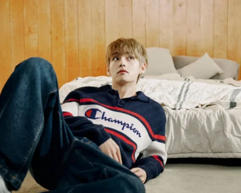 V de BTS en una cama
